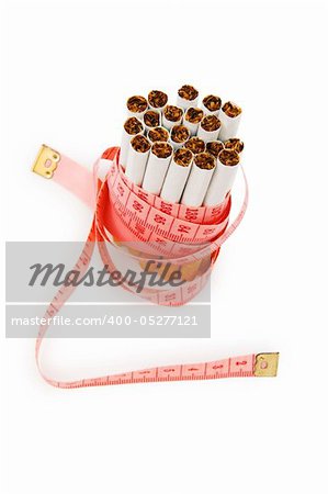 Smoking concept with measuring tape and cigarettes