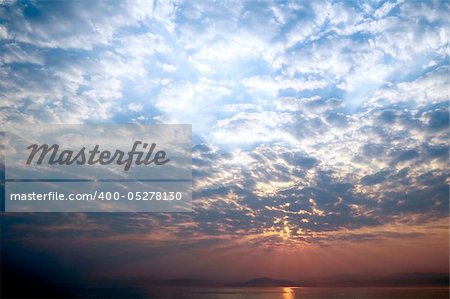 Sunrise over the sea and clouds in the sky