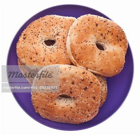 Everything Bagels in a Vibrant Purple Bowl  Isolated on White with a Clipping Path.