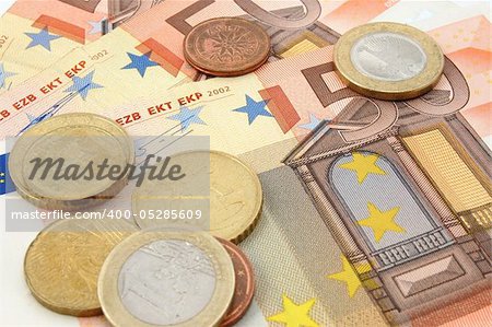 macro of euro bills and coins can be used as background