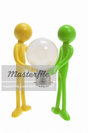 Miniature Figures with Lightbulb on White Background