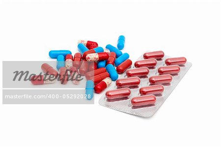 macro of medical pills isolated on white background