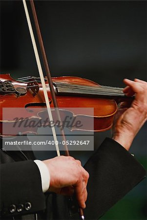 Musician playing violin with expression
