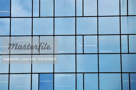 Facade of a modern glass building. Architectural detail.
