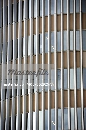 Glass facade of a modern office building. Architectural detail.