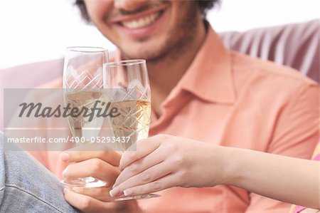 young couple smiling and drinking together