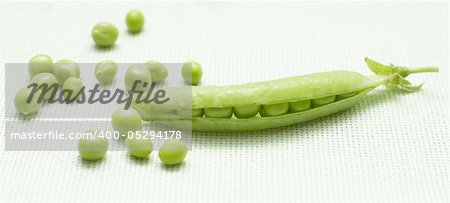 Green peas on linen background