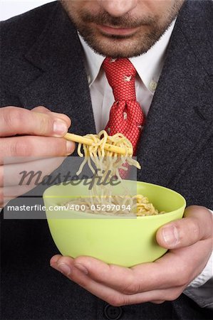 Man holding a bowl of soup  noodles