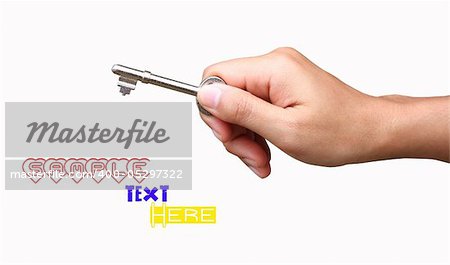Hand with key over white background