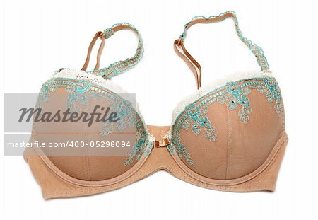 Beige bra with blue embroidery on white background