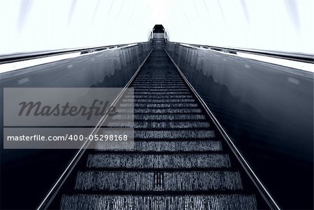 Escalator ladder in the light tunnel .
