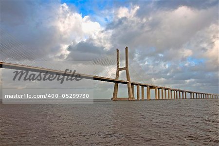 The new highway over the river Tagus in Lisbon, was commissioned in  April 1, 1998 g - to 500-th anniversary of explorer Vasco da Gama  sea route from Europe to India. Bridge - one of several large-scale  construction projects on the Iberian peninsula, made in  commemorate the 500 th anniversary of the discovery of America. The total length of the bridge Vasco da Gama, 17 km