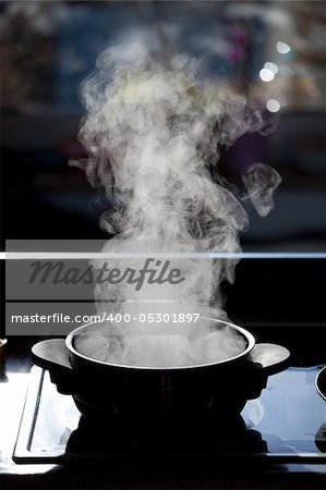 steam rising off a boiling pot