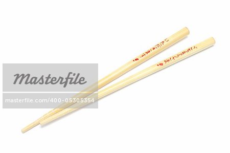 Pair of wooden chopsticks isolated on white background with words itadakimasu and gochisousama