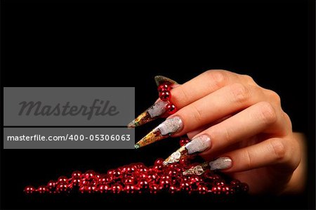 Human fingers with long fingernail and beautiful manicure isolated on black