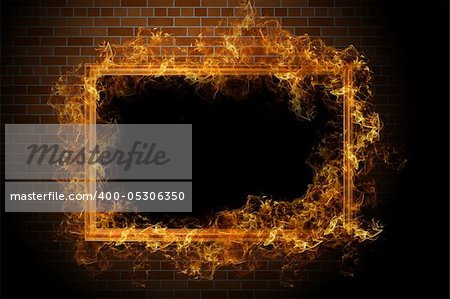 Empty frame with fire on the brick wall