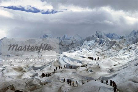 A group of trekkers explores one of the faces of the magnifiscent Perito Moreno Glacier in El Calafate, Argentinian Patagonia. Nikon D60, VR 18-55mm Nikkor zoom lens set at 55mm. Exposure f/11 and 1/200s. No flash. January 27th, 2011.