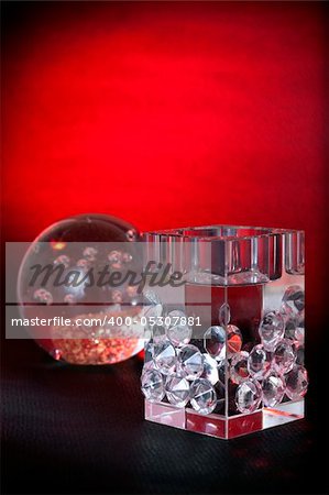 Cube and ball crystal decoratives, background shoot with red gel