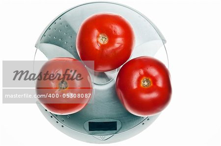 Tomatoes isolated on food scale
