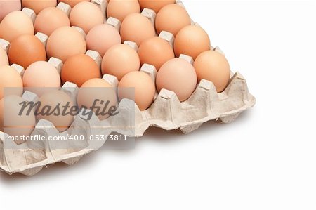 many brown eggs isolated on white