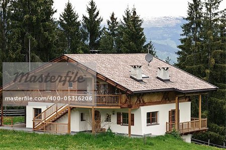 Traditional wooden House with Forest in Tyrol, Austria
