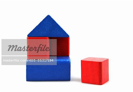 Wooden building blocks on white background. Close Up.