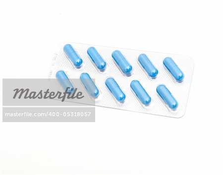 macro of medical pills on white background