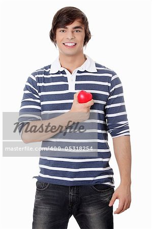 Young man with heart. Isolated on white background.