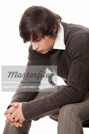 Depressed young man. Isolated on white background.