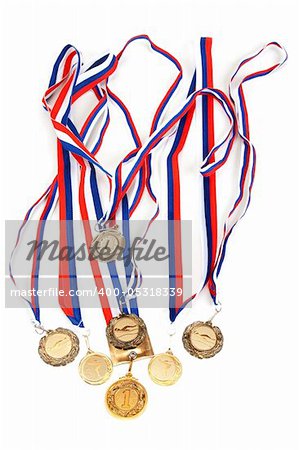 Golden medals with tape on white background