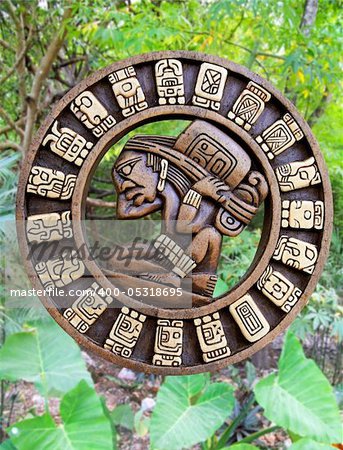 Calendar Mayan culture wooden on jungle background Mexico