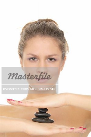 woman holding pile of stones on the palm of your hand isolated on white