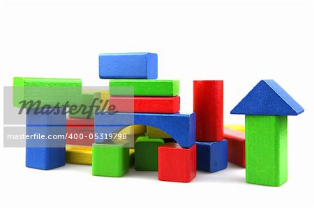 Wooden building blocks on white background. Close Up.