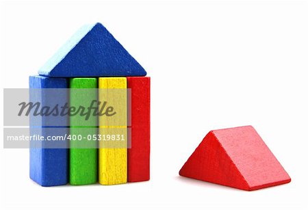 Wooden building blocks on white background. Close Up.