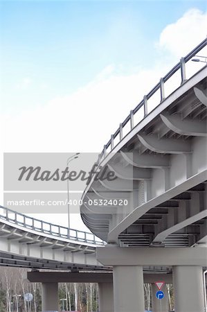 automobile overpass on background of blue sky with clouds. bottom view