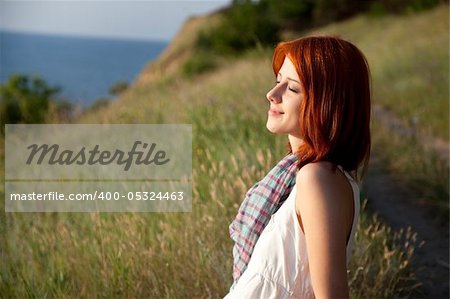 Girl at hill in sunrise.