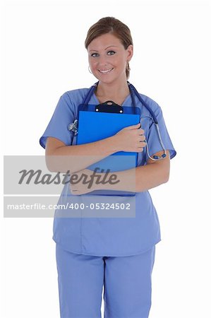 A attractive female nurse with a friendly smile standing holding a clipboard, isolated on a solid white background.