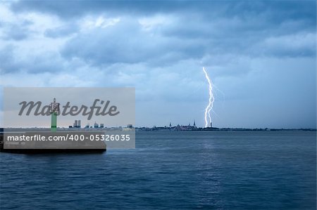 Lightning over a city of Tallinn at night.