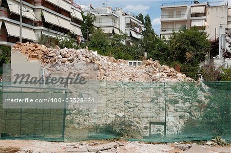 Pile of rubble from a demolished building and debris netting.