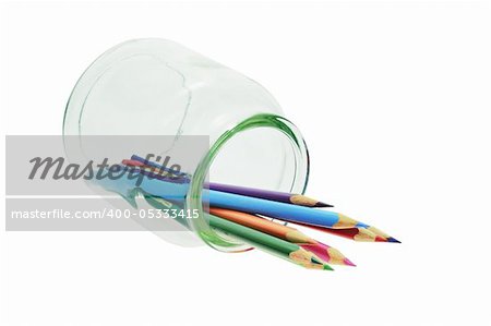 Color pencils in glass container on white background