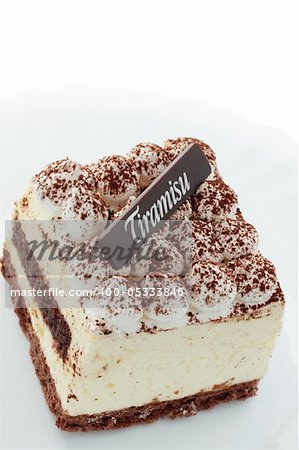 Tasty pastry tiramisu on the white plate