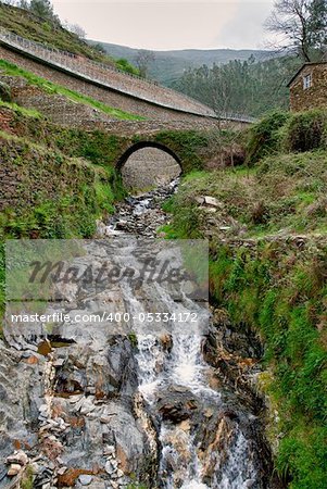 Old small bridge at Piodao is a very old little mountain village, in Arganil, Portugal.