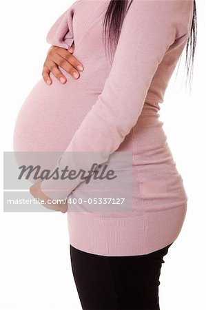 Beautiful pregnant black woman touching her belly