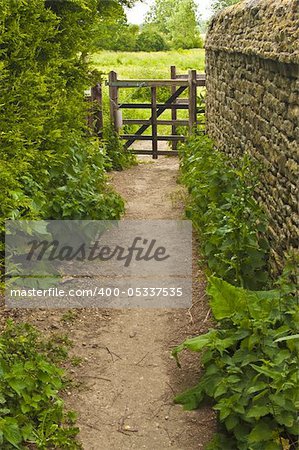 Country path with a gate at the end