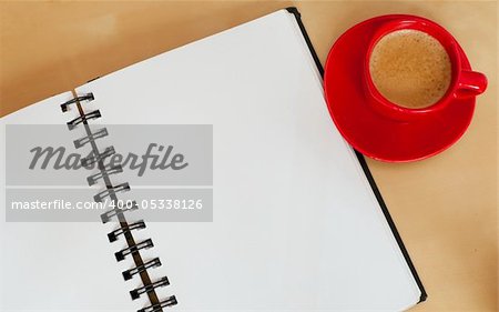 Espresso Coffee and Blank Paper Notebook on Wooden Table