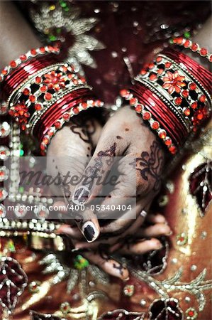 An Indian bride and the henna artwork on her hands