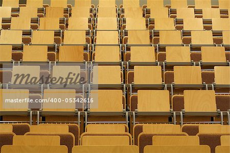 empty university class room with wooden seats