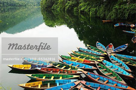 Colorful tour boats at the lakeside of the Fewa Lake, Nepal