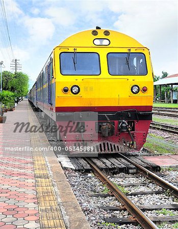 Thai colorful train arriving at station