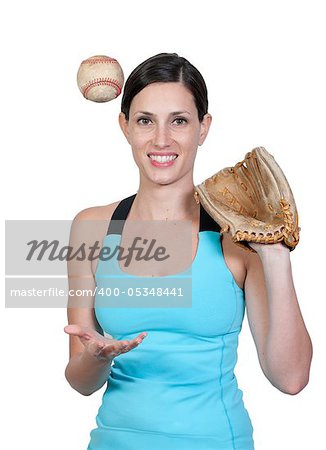 A beautiful woman catchinging a baseball at a ball field